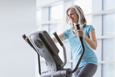 A woman doing an elliptical workout for weight loss